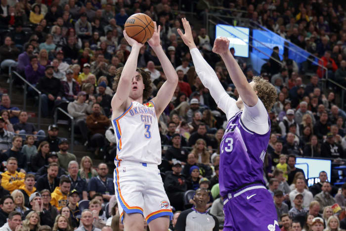 Jan 18, 2024; Salt Lake City, Utah, USA; Oklahoma City Thunder guard Josh Giddey (3) shoots the ball past Utah Jazz forward Lauri Markkanen (23) during the second quarter at Delta Center.
